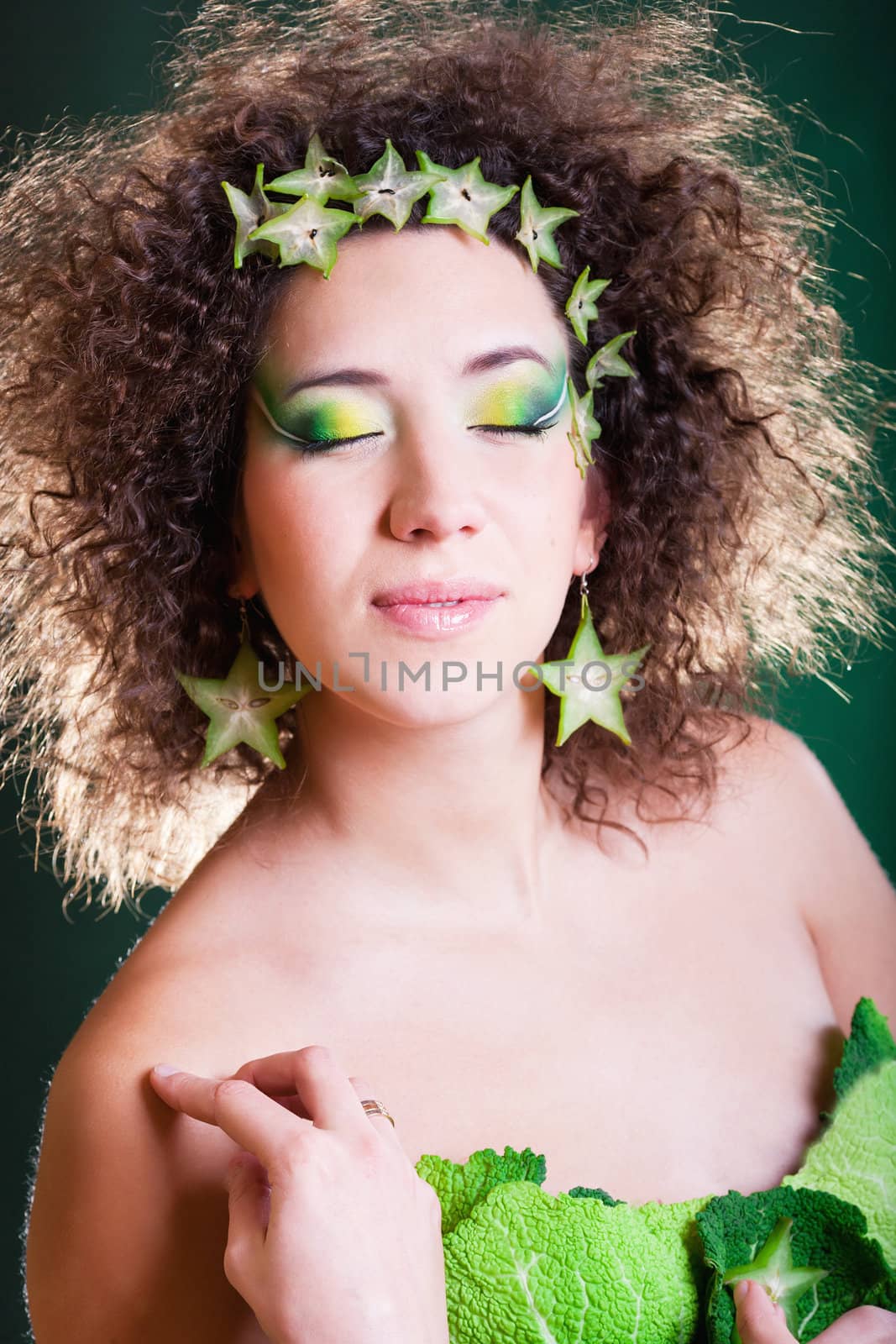 beautiful pregnant young woman dressed in cabbage