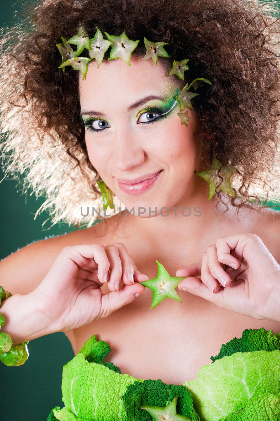 beautiful pregnant young woman dressed in cabbage