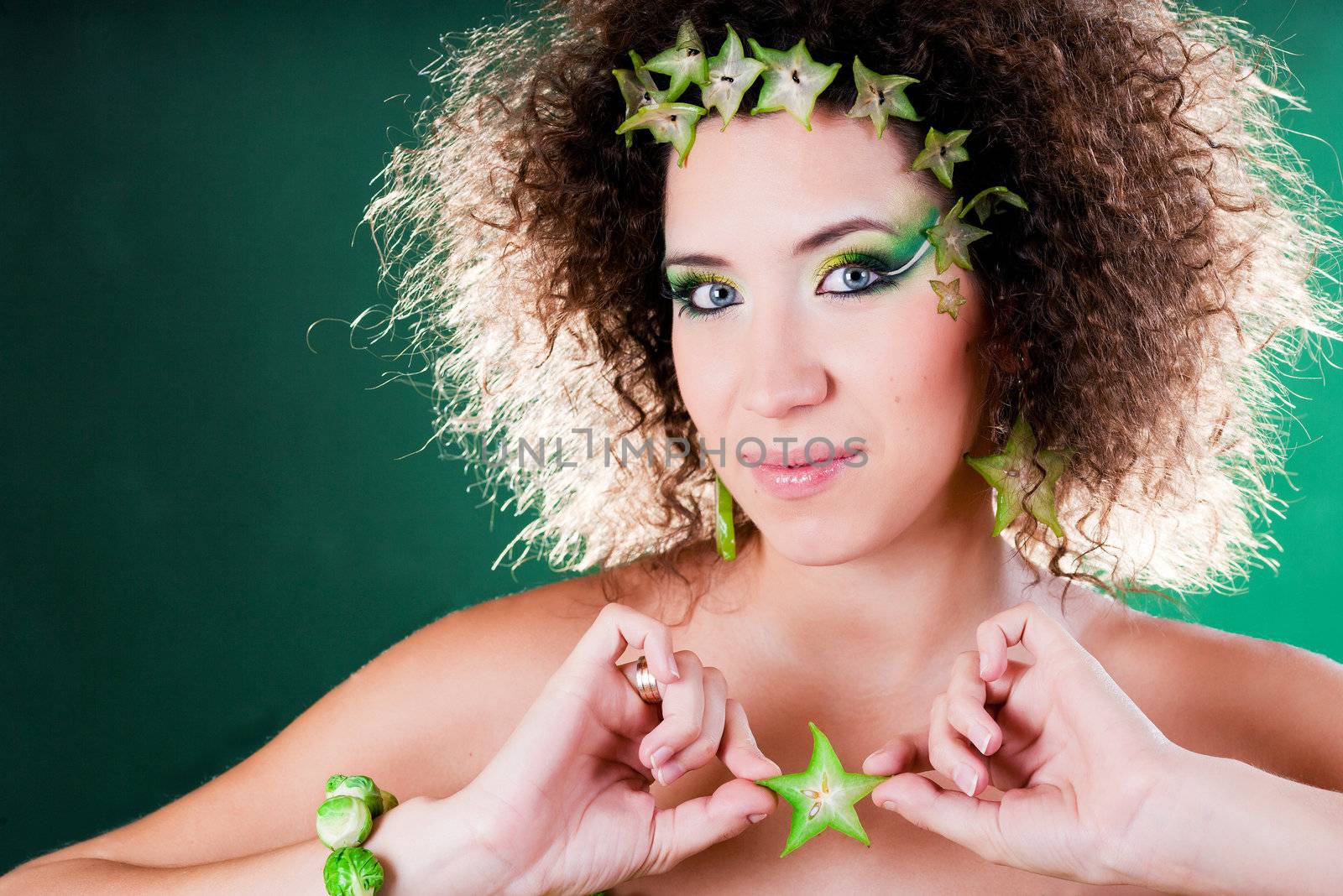 beautiful pregnant young woman dressed in cabbage