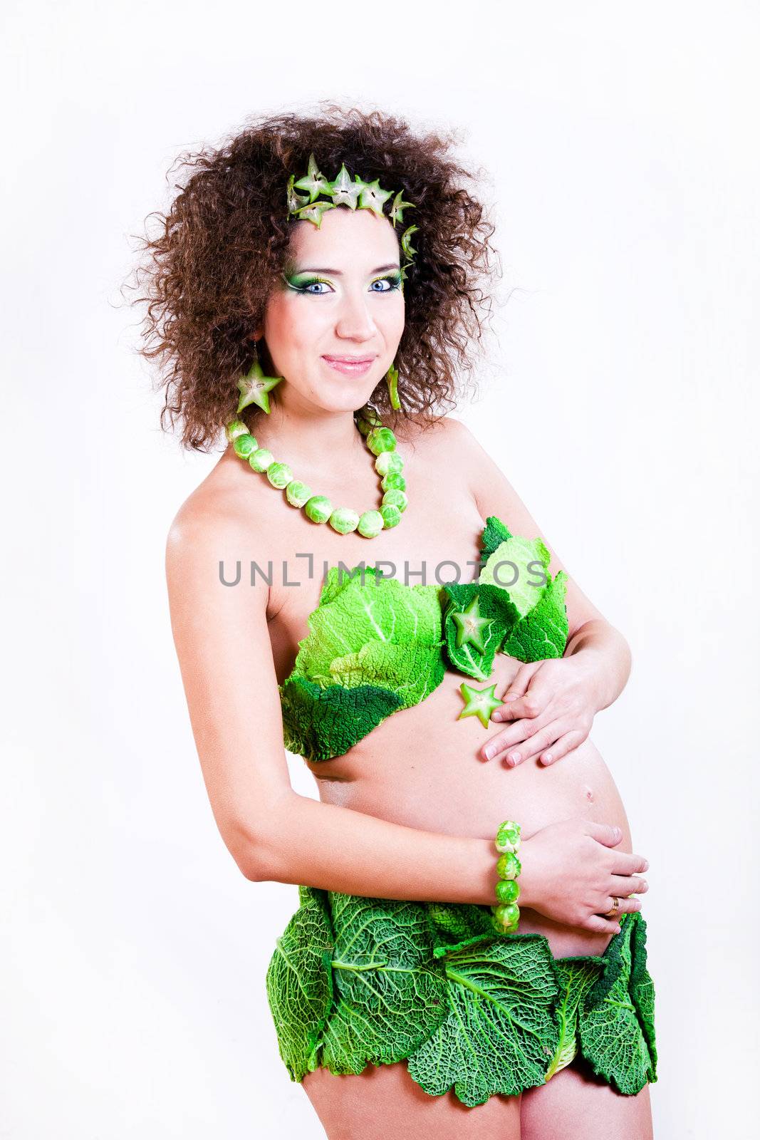 beautiful pregnant young woman dressed in cabbage