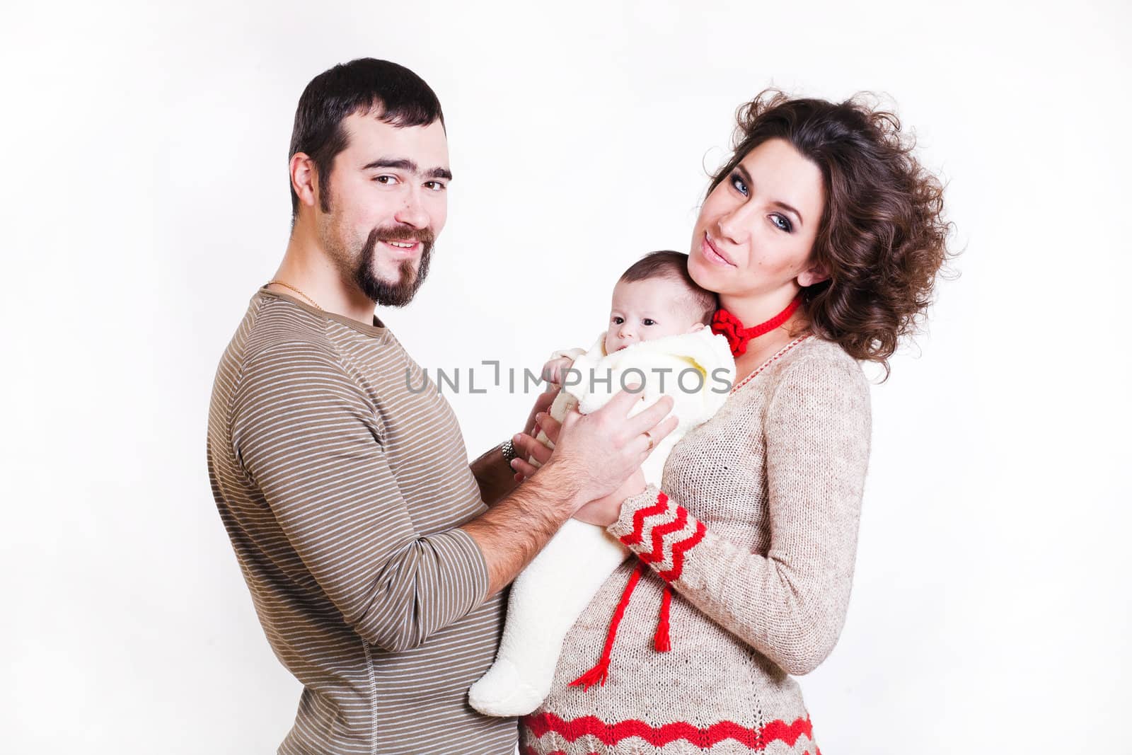 beautiful pregnant woman in a sweater with baby by dvernytska