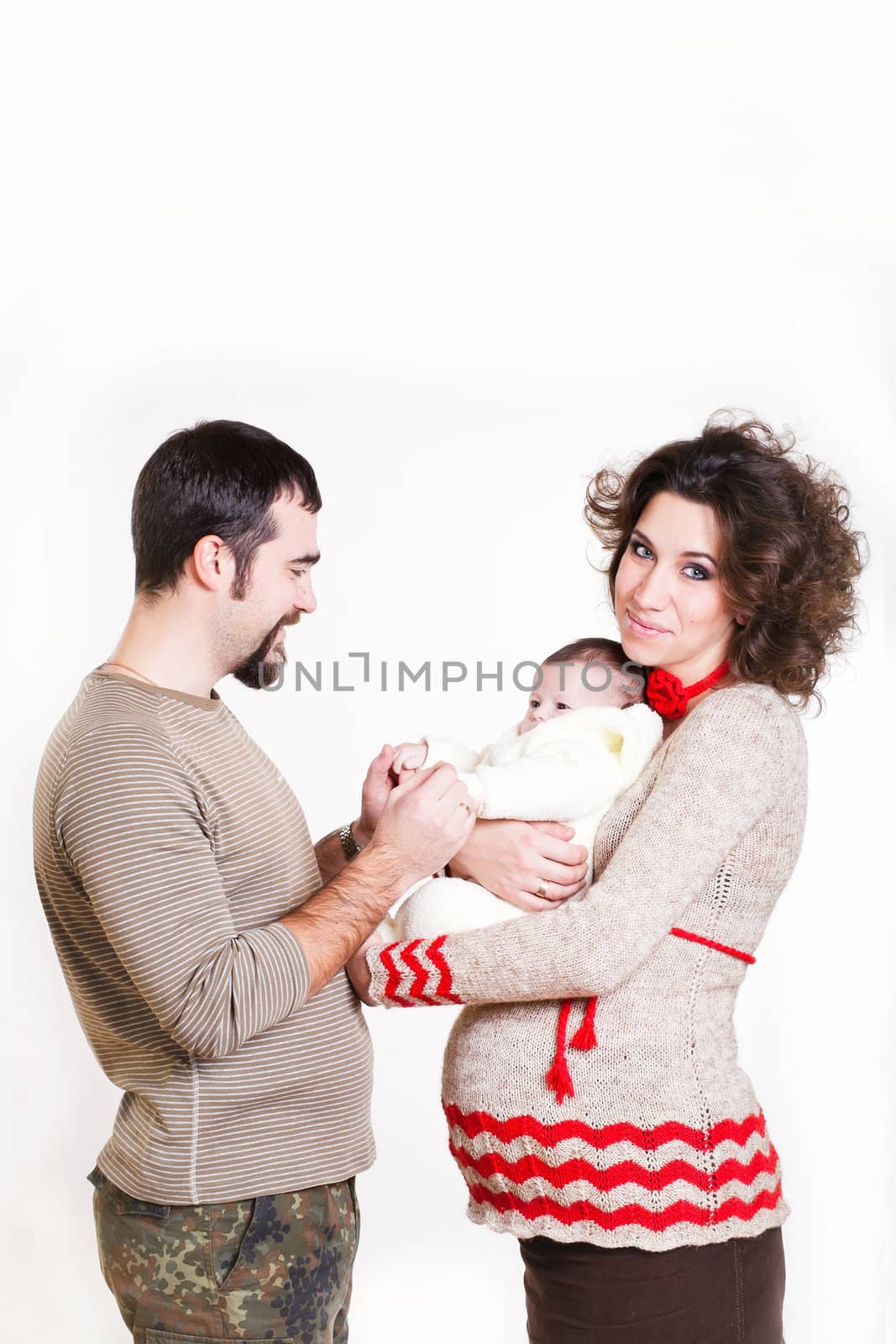 pregnant woman with her ​​husband and child isolated on white background