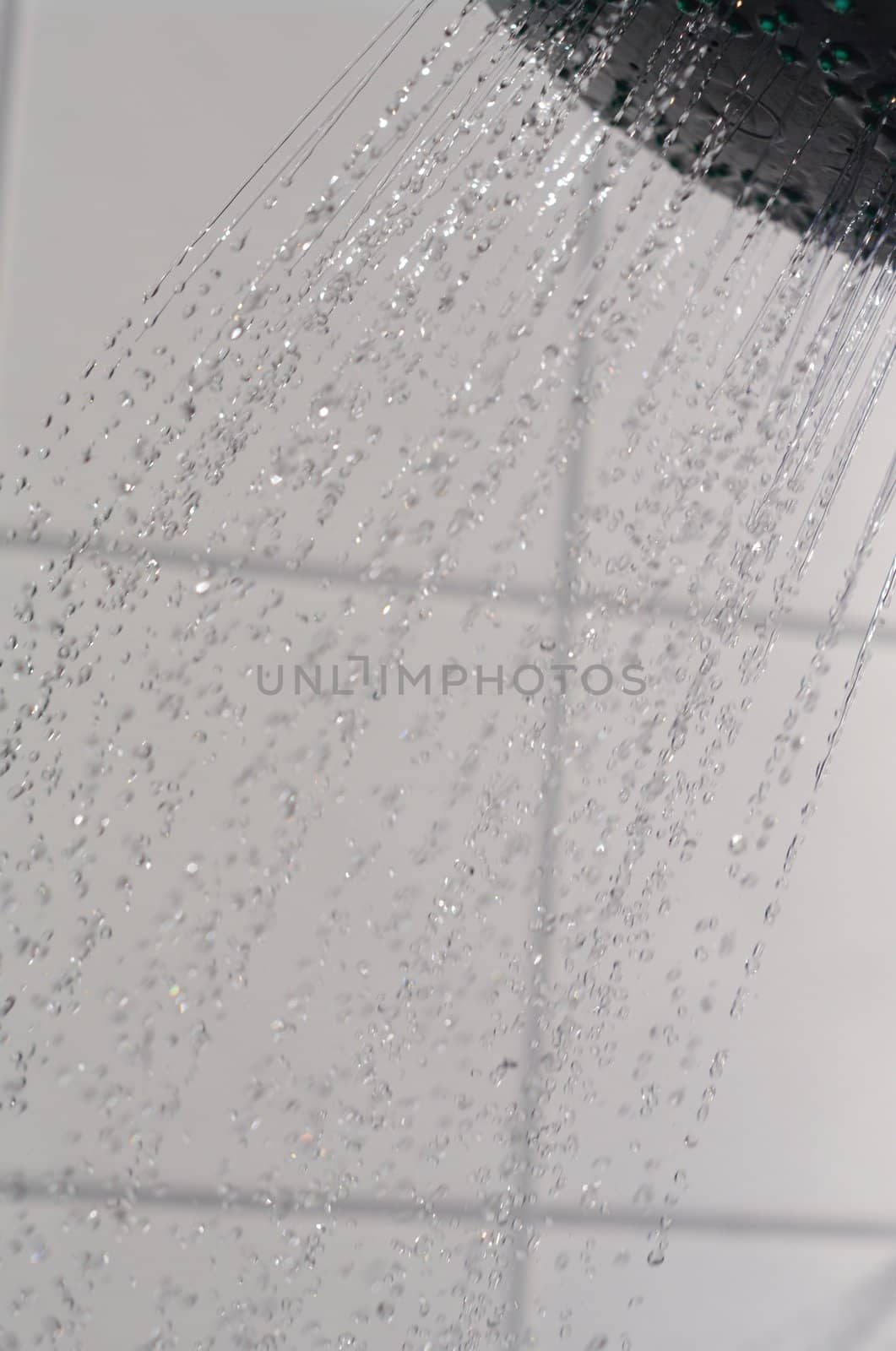 water drops falling from a shower indoors