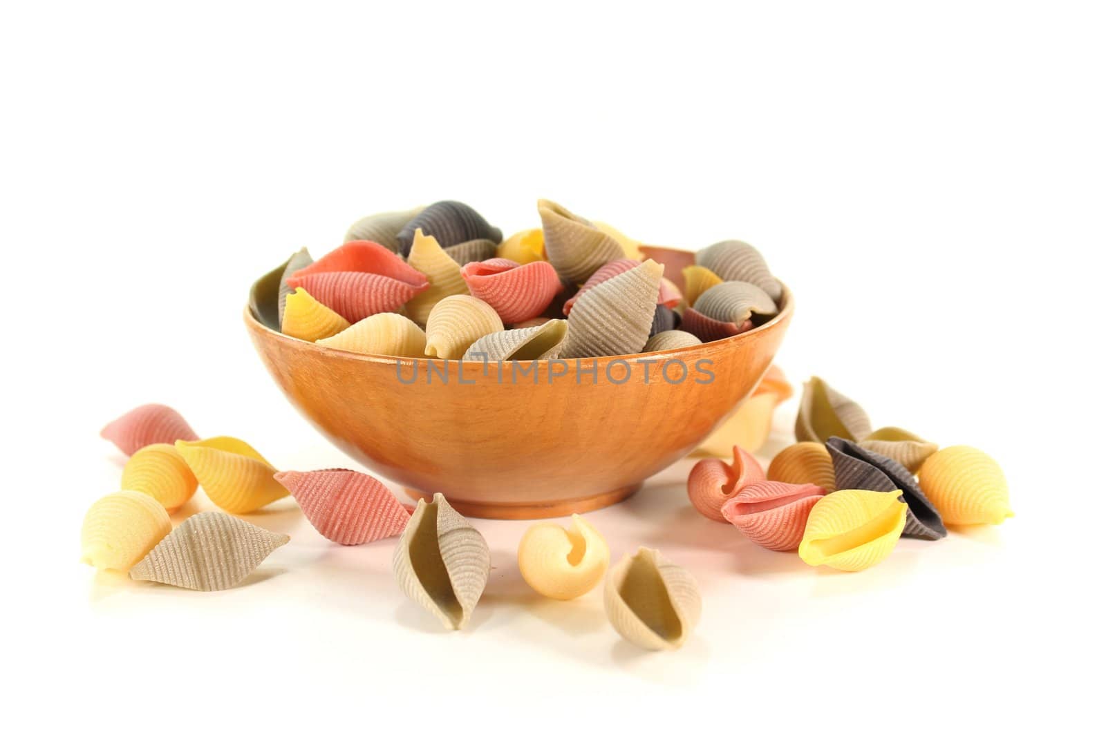 colorful raw pasta on a white background