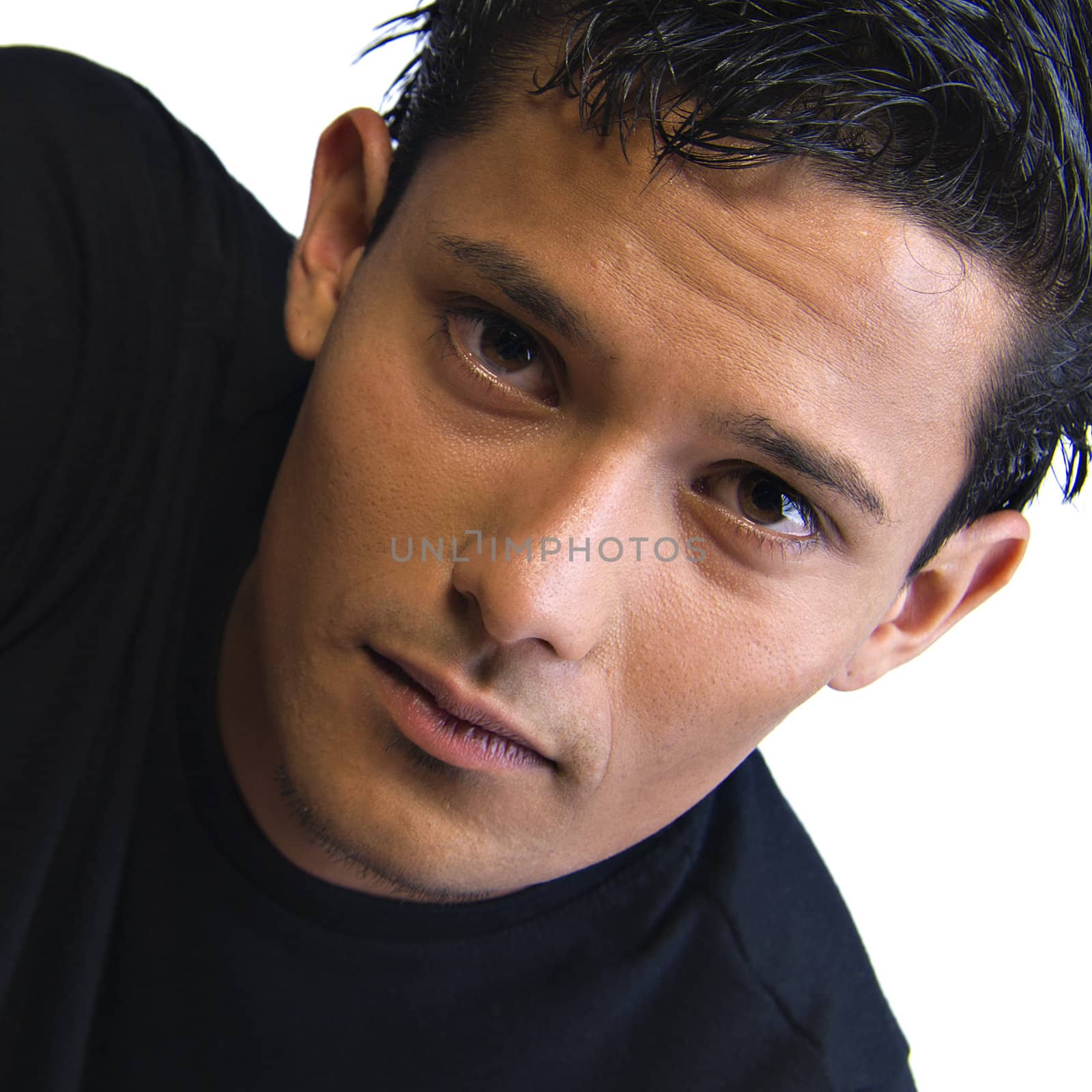 Studio portrait of mixed race young man looking serious