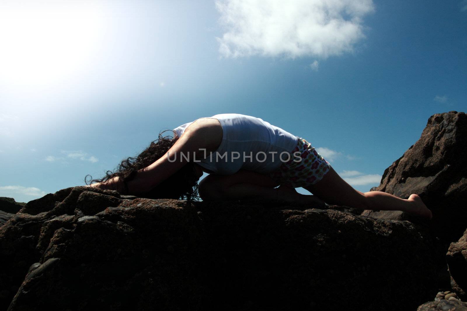 a beautiful woman doing yoga to show a healthy way to live a happy and relaxed lifestyle in a world full of stress