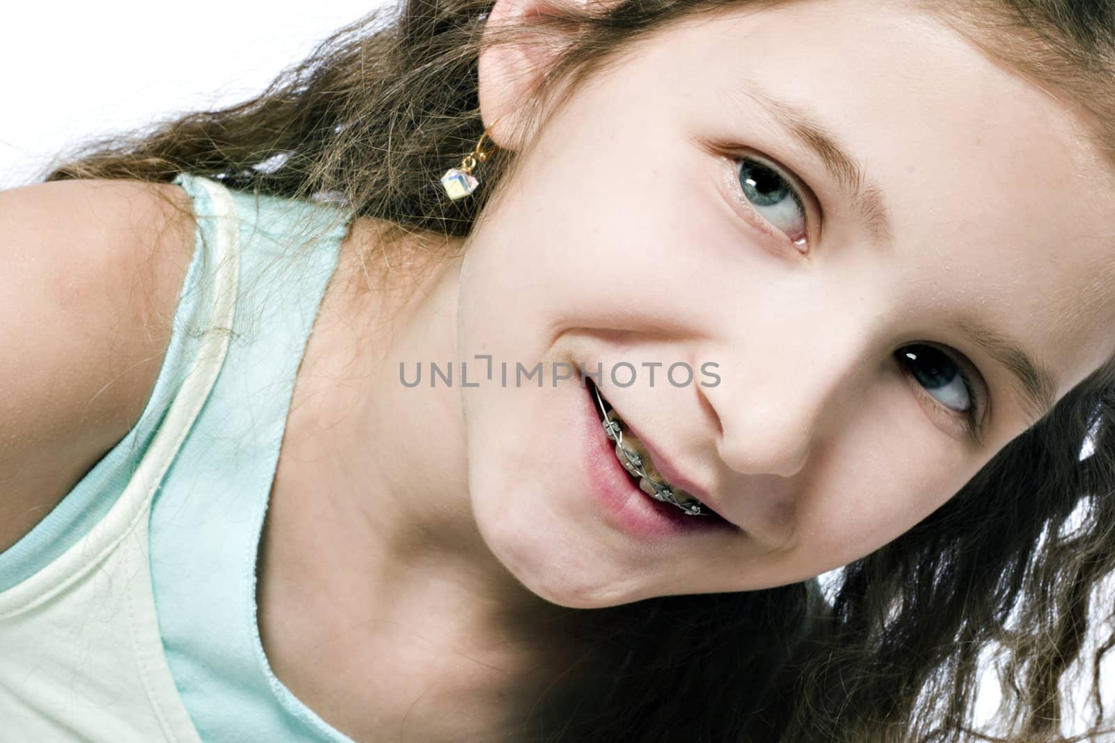 Studio portrait of a young girl looking happy