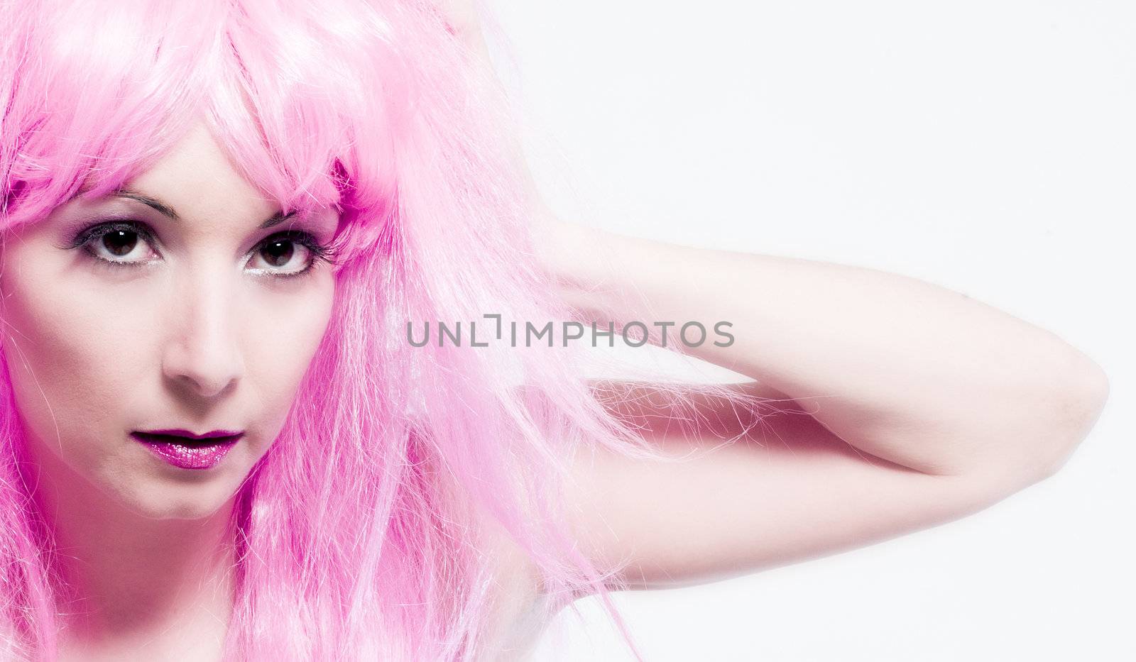 Portrait of a woman in front of a white background in a studio enviroment