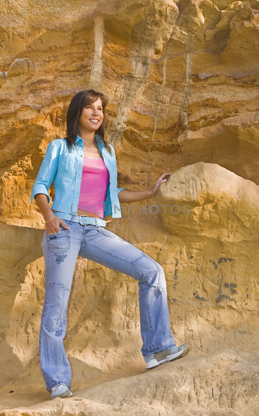 Young woman in a rocky environment.
