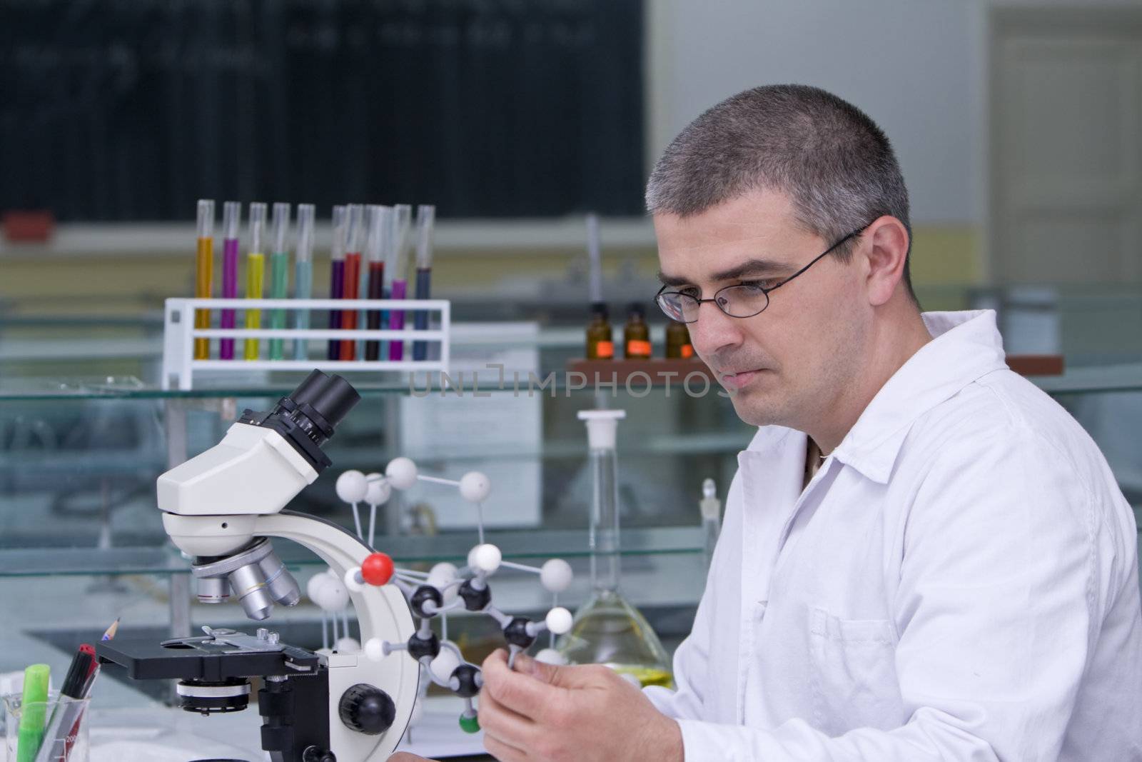 Researcher thinking about an experiment at his workplace.