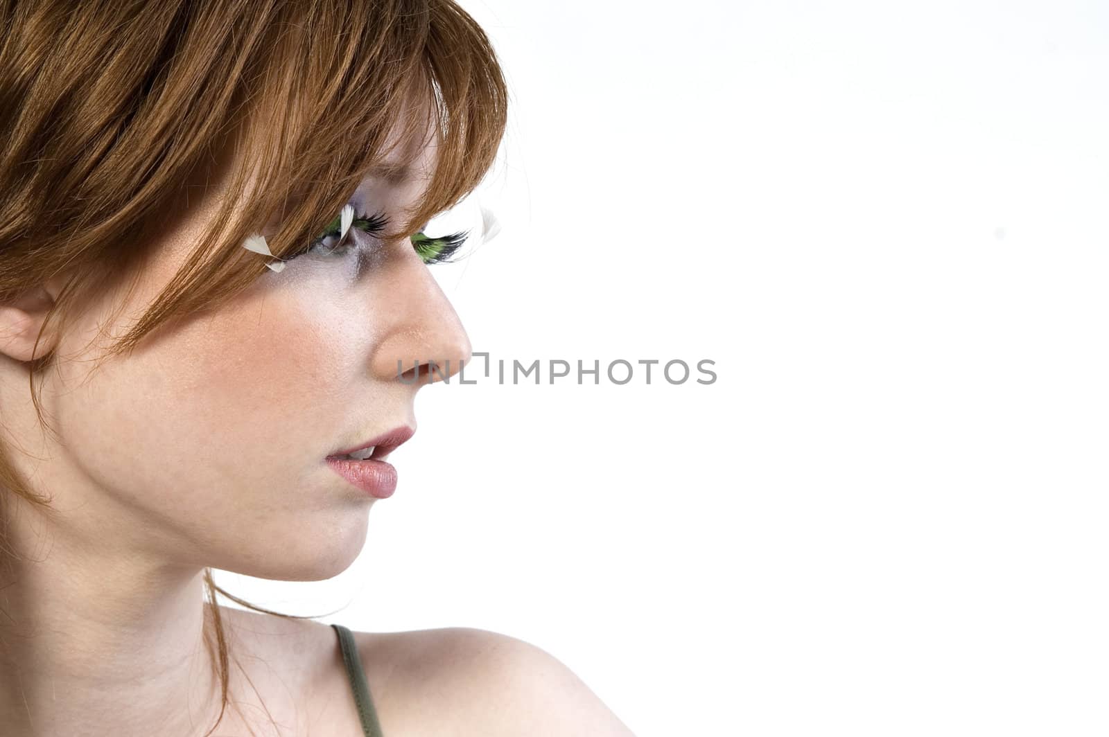 Portrait of a red haired girl looking away