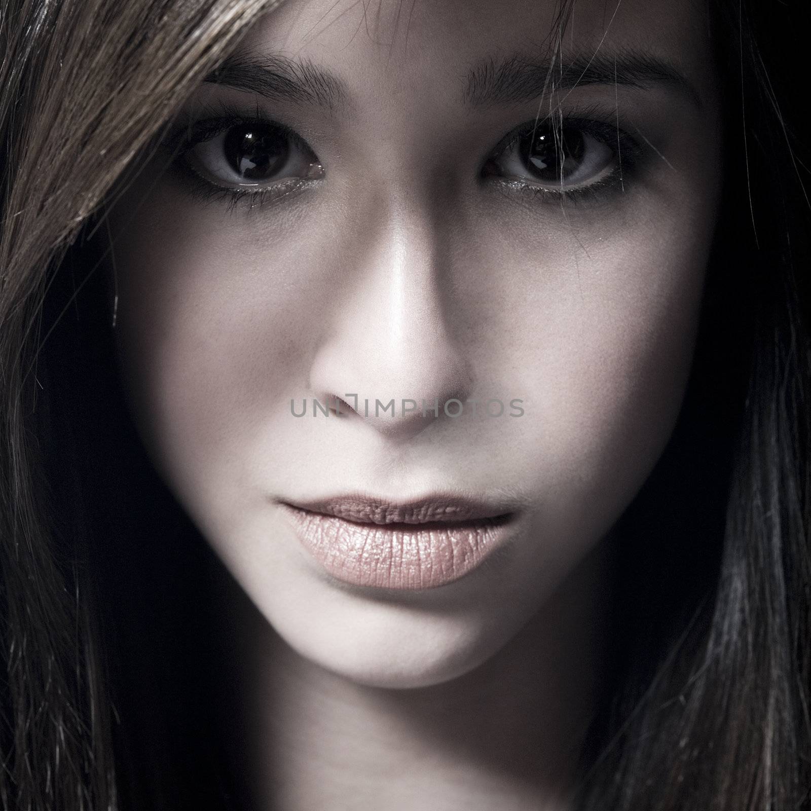 Studio portrait of a beautiful mixed race, vietnamese girl 