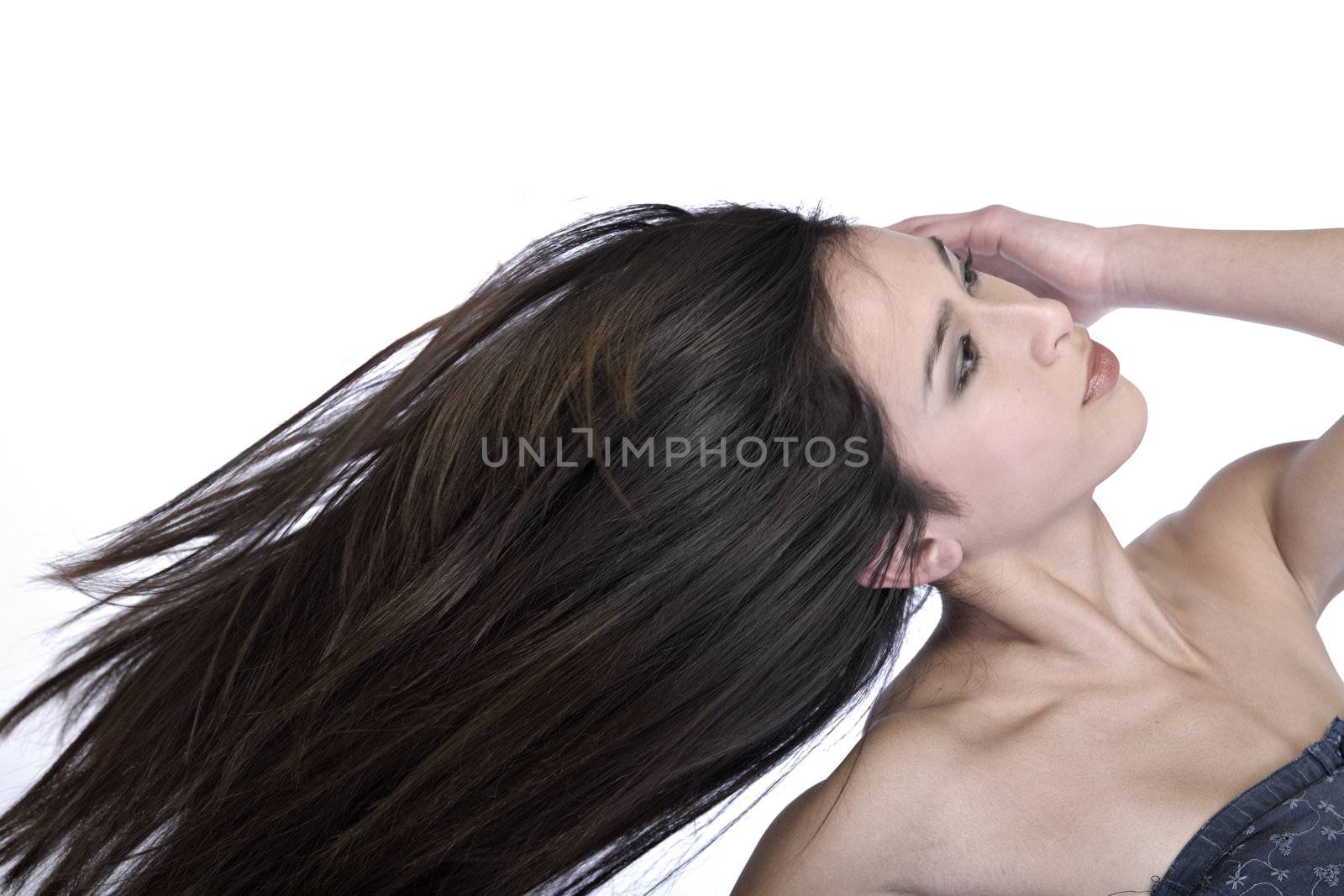 Studio portrait of a beautiful mixed race, vietnamese girl with long hair