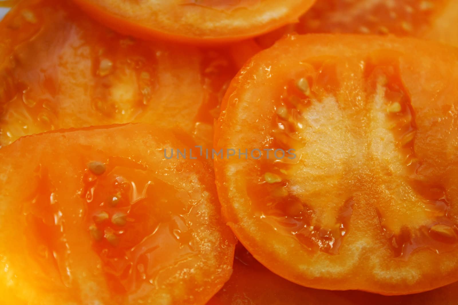 Close up of the yellow sliced tomato.