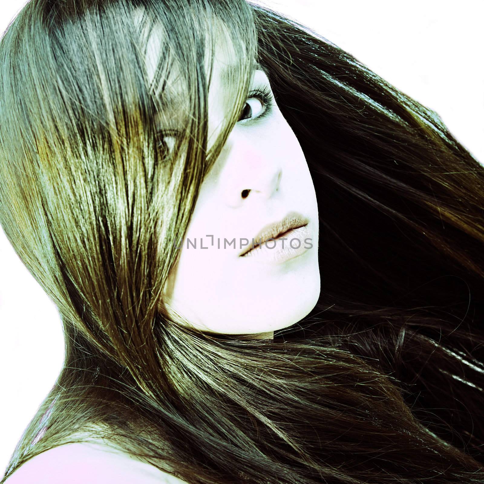 Studio portrait of a beautiful mixed race, vietnamese girl in a cross-process