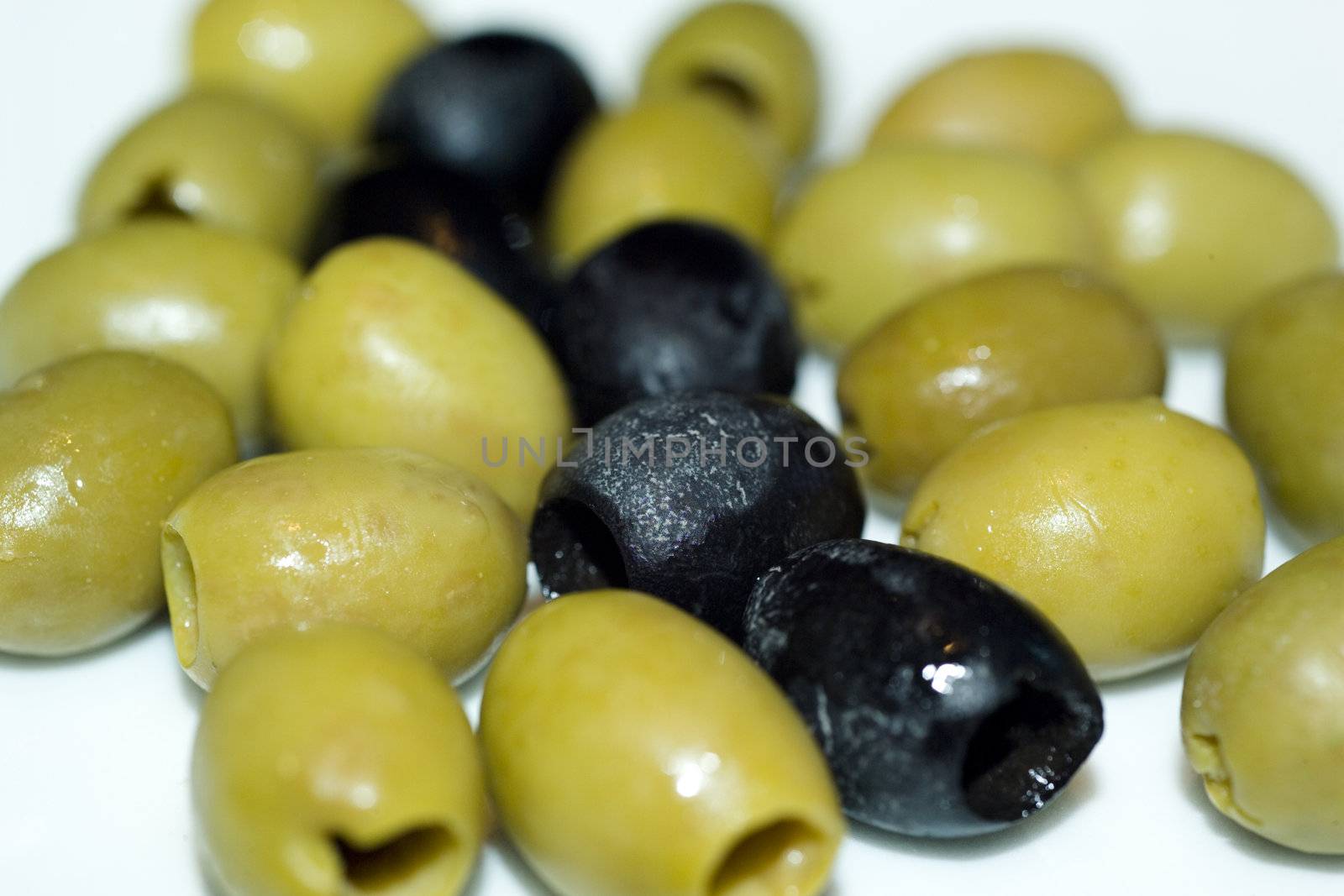 macro shot of green and black olives