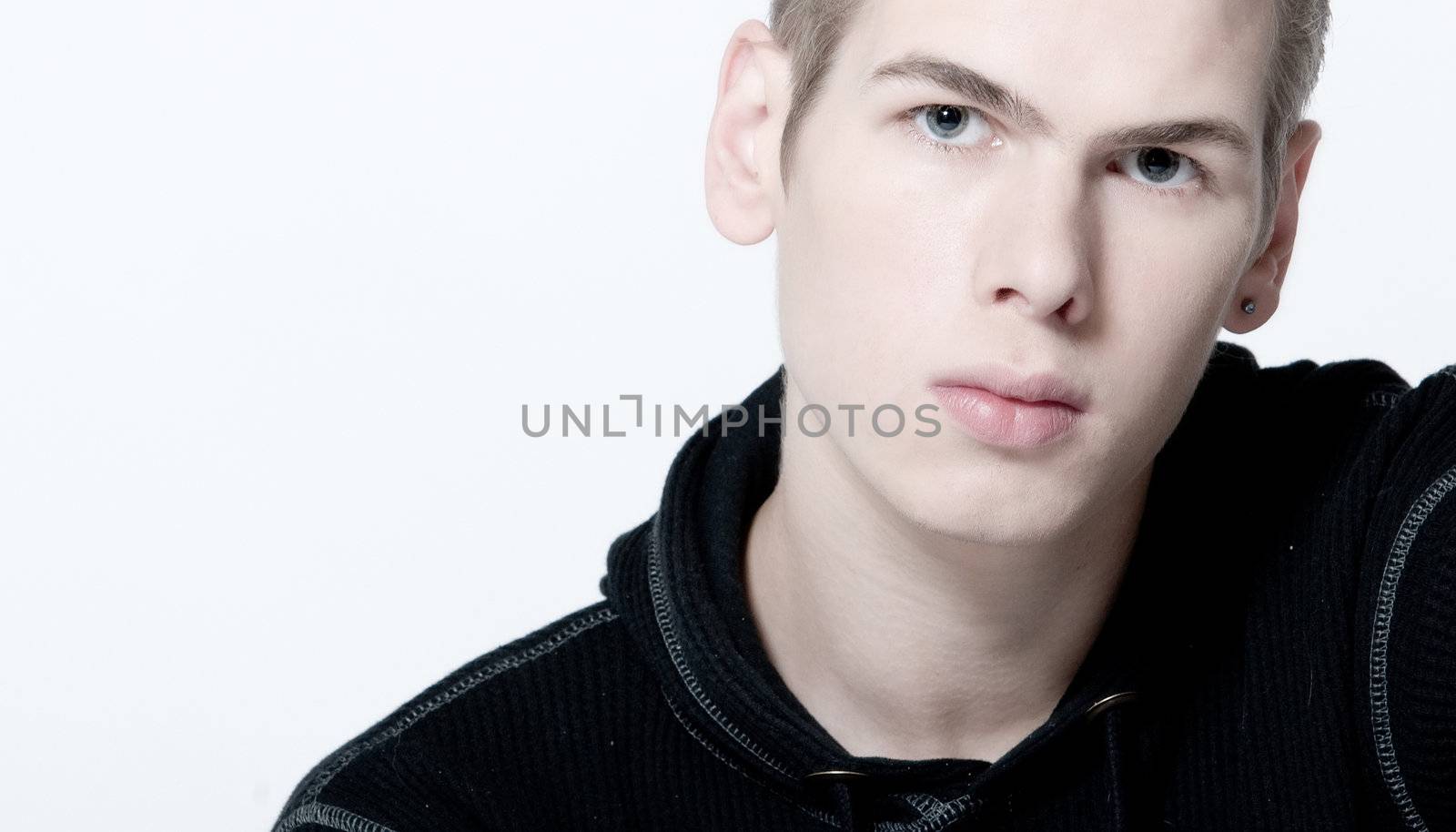studio portrait of am angry looking young man 
