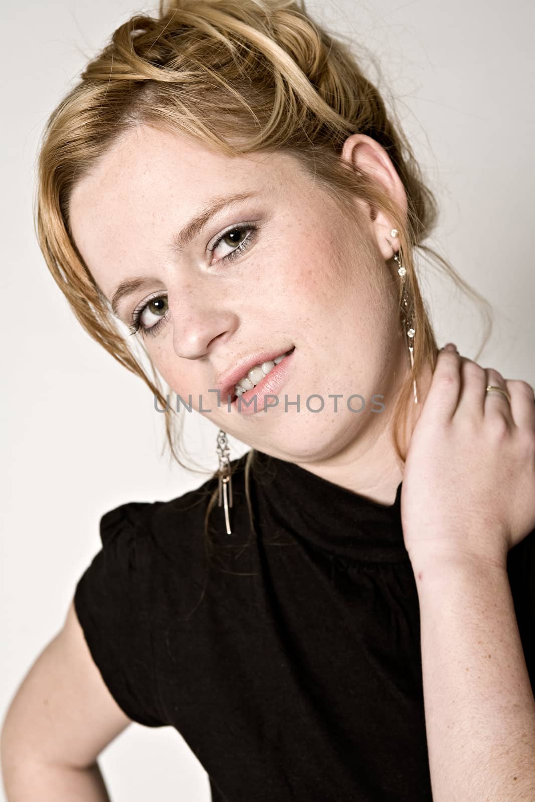 Studio portrait of young girl with reddish hair looking fit
