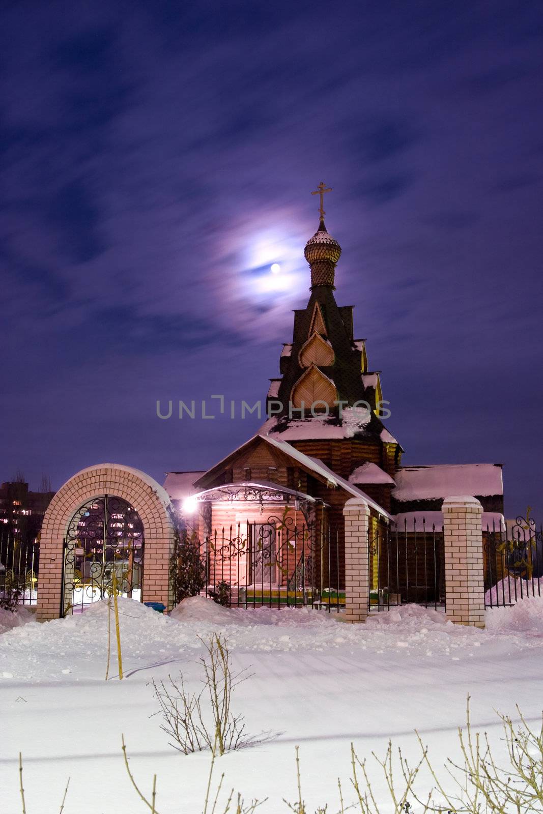 Church in a snow at a moonlight