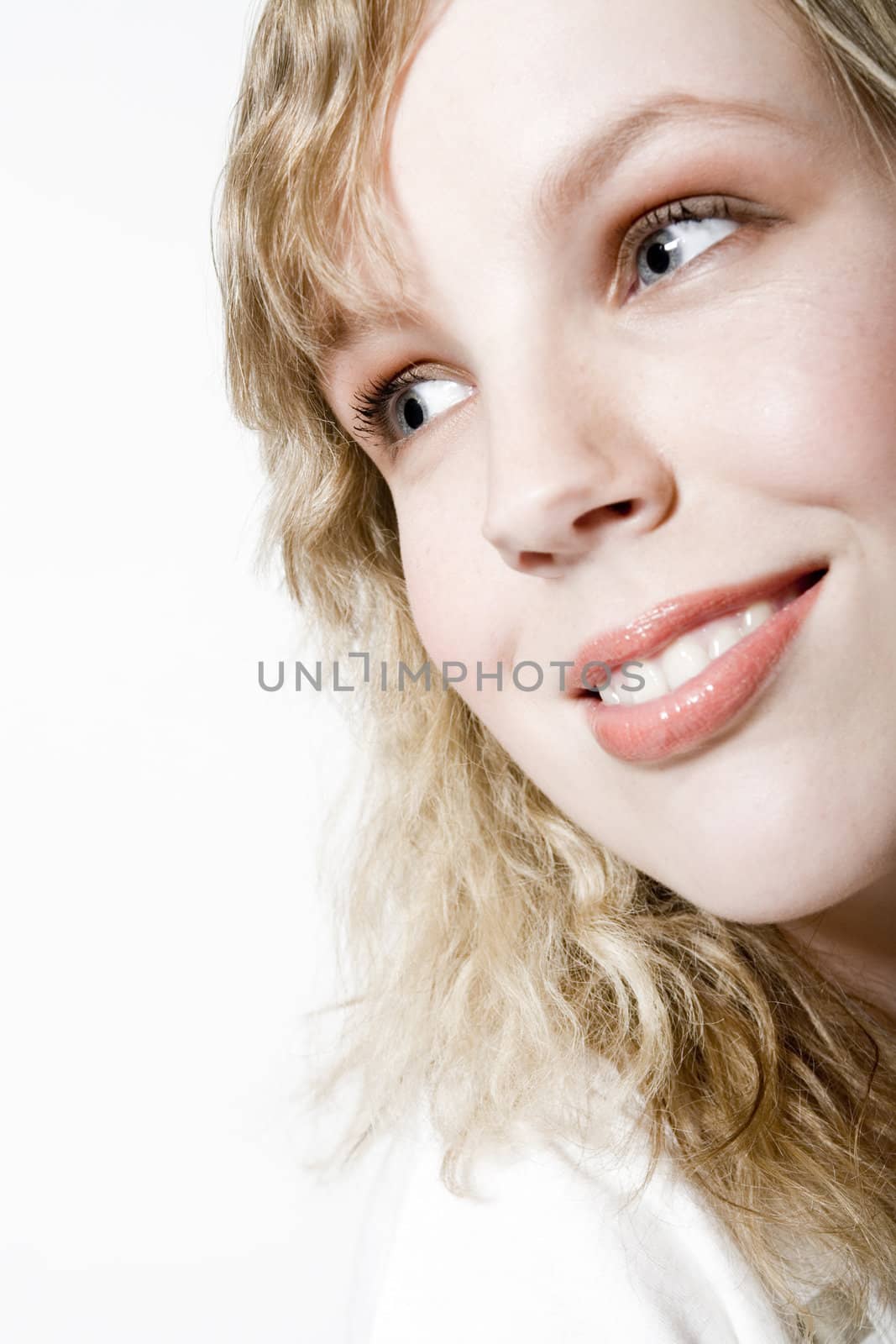 Studio portrait of a curly blond female