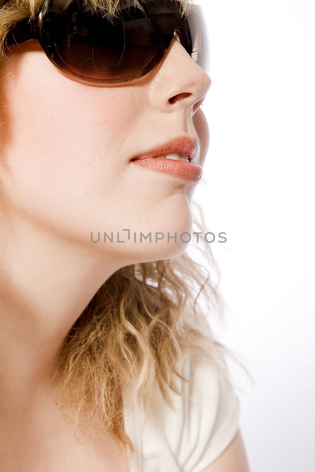 Studio portrait of a curly blond female