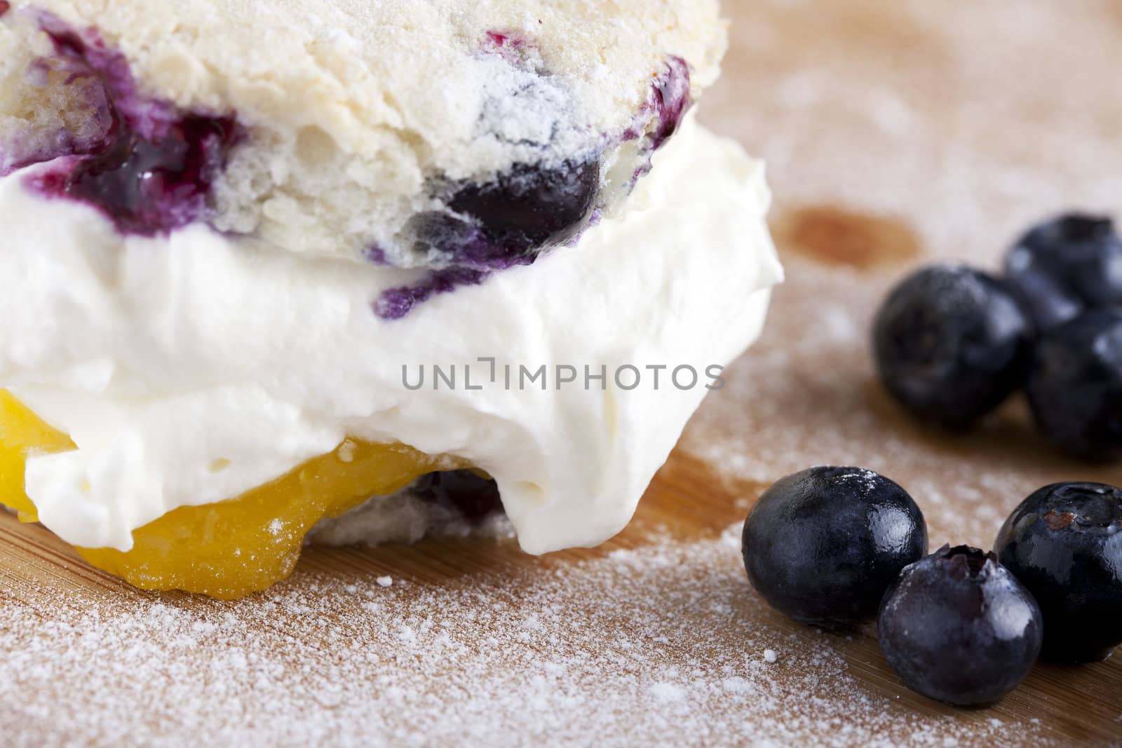 Fresh cream filled pastry and blueberries.