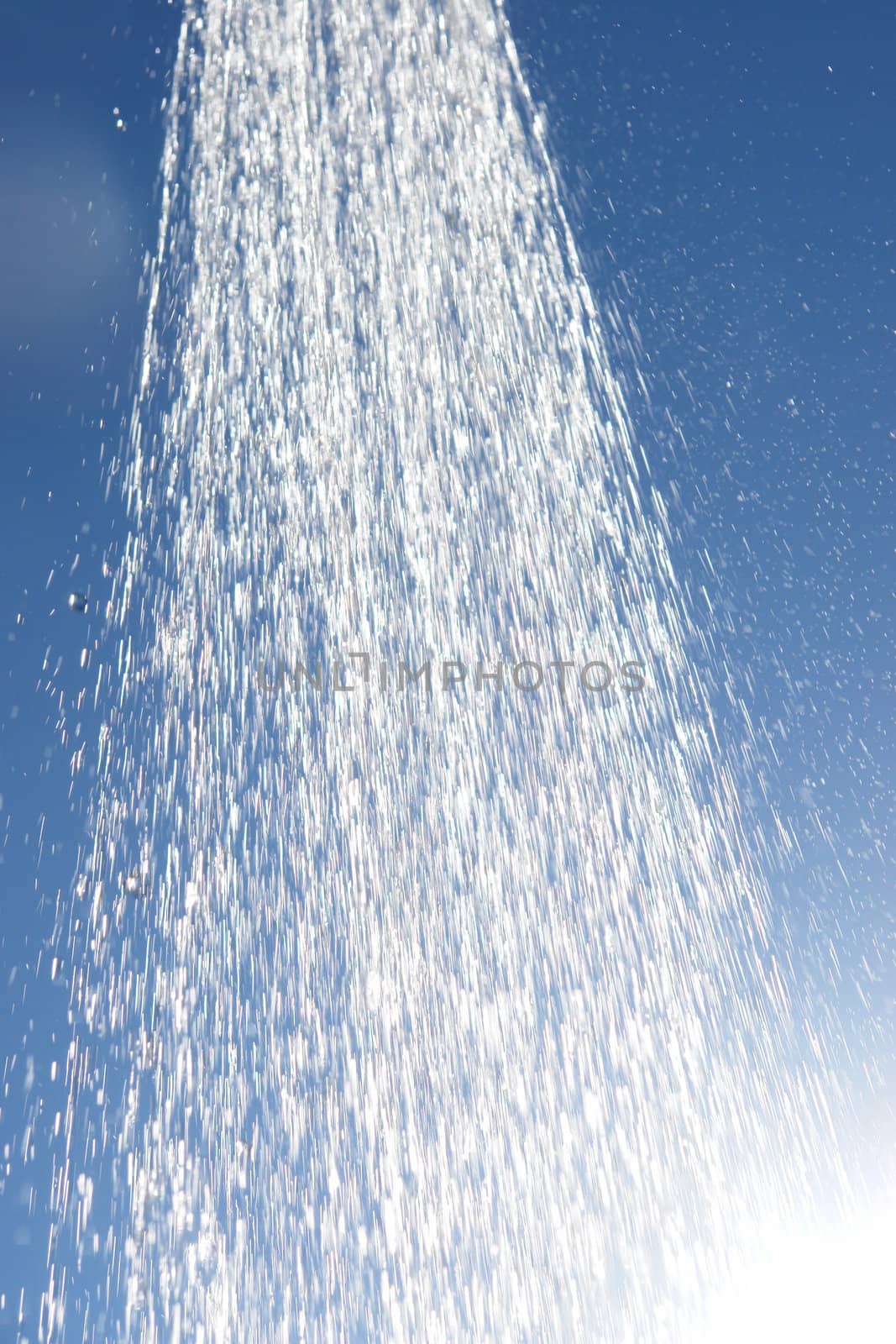 water drops falling from a shower outside