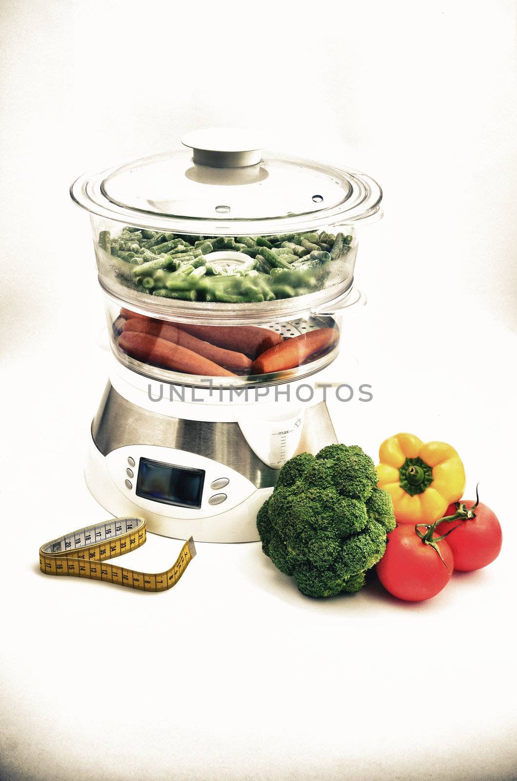 Steamer with vegetables and a measuring tape, concept
