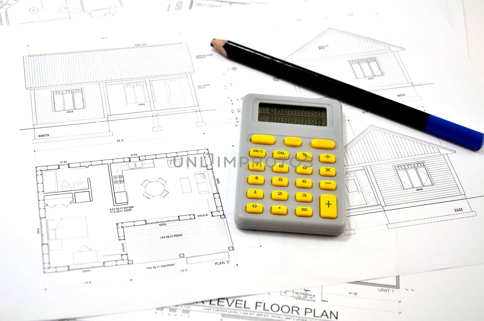 draft plan of building a house, pencil and calculator