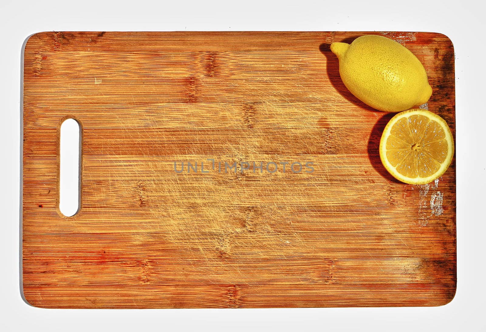 two lemons on the kitchen board, concept, space for text