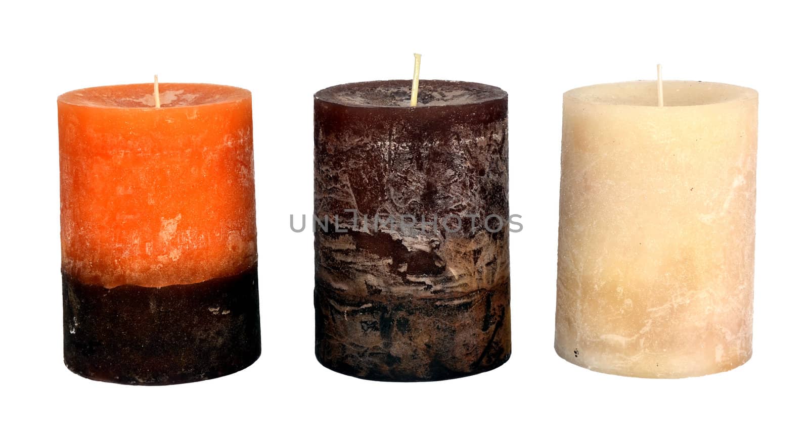 three Christmas candles isolated on white