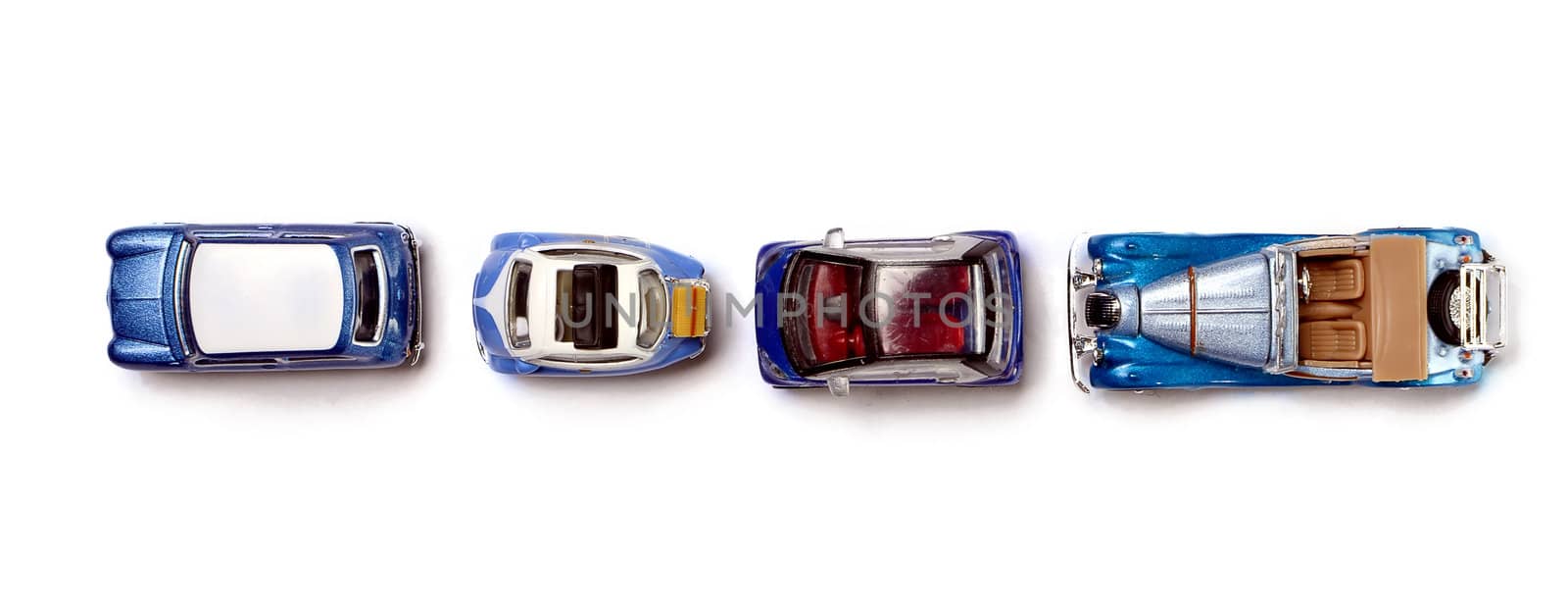 four miniature cars from the top isolated on white
