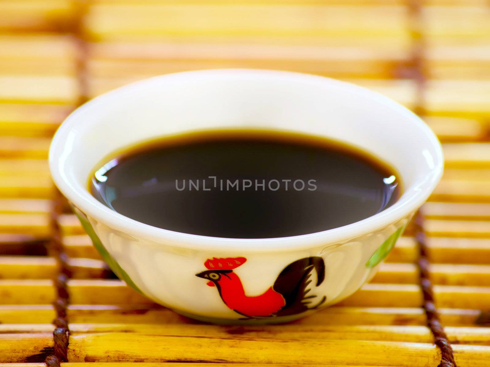 close up of a bowl of soy sauce