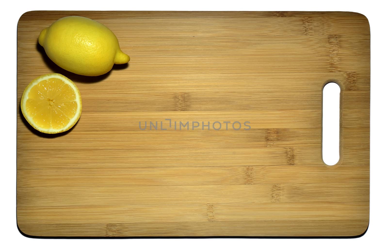 Kitchen board with two lemons isolated on white, space for text