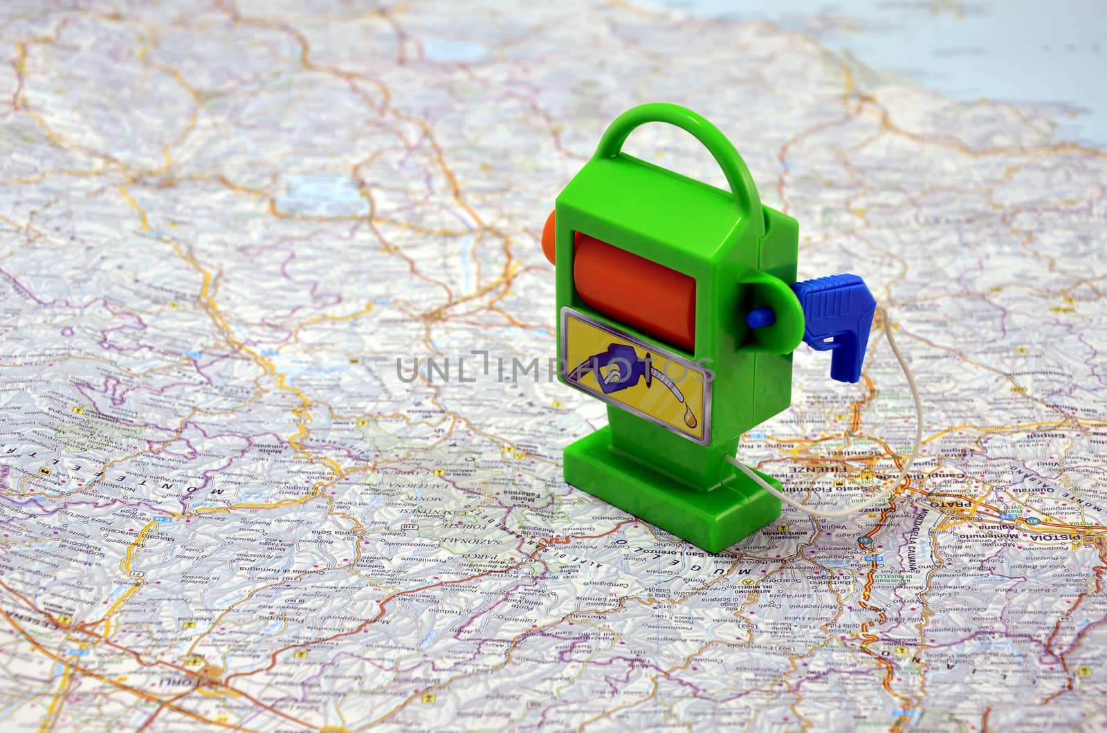Toy Petrol-station on Italy map. Concept