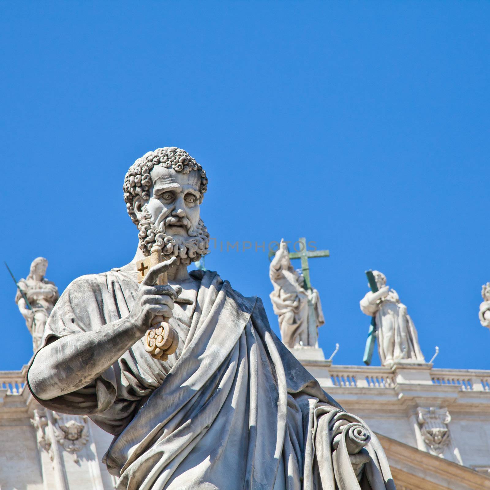 St Peter statue in St. Peter Square (Rome, Italy) with blue sky background