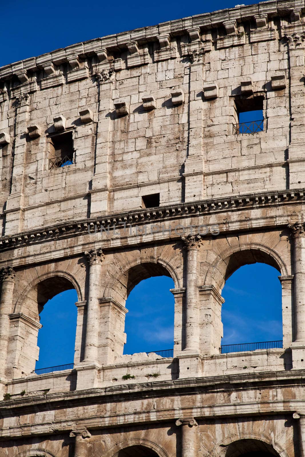Colosseum in Rome with blue sky, landmark of the city