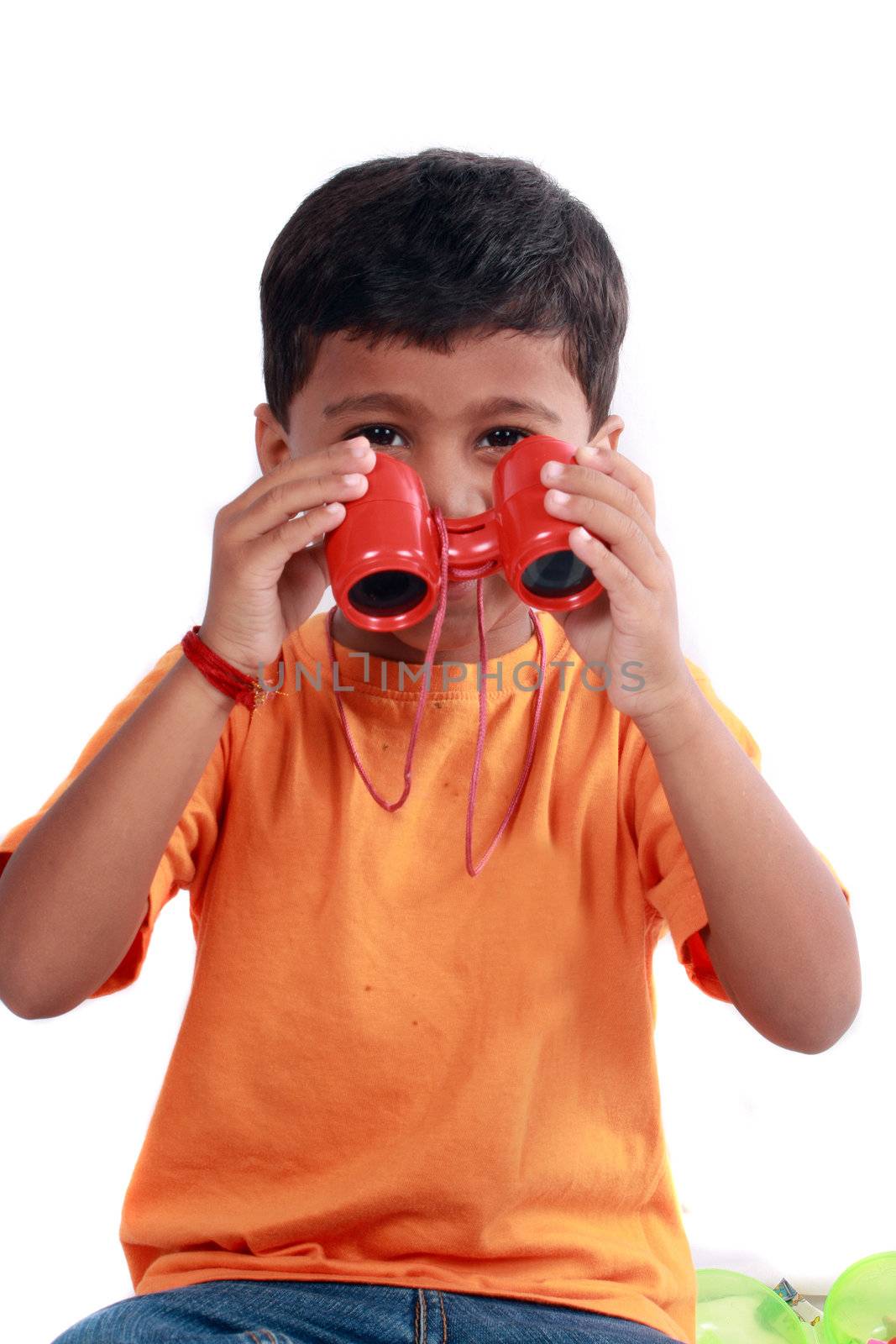 A small indian boy with a pair of binoculars.