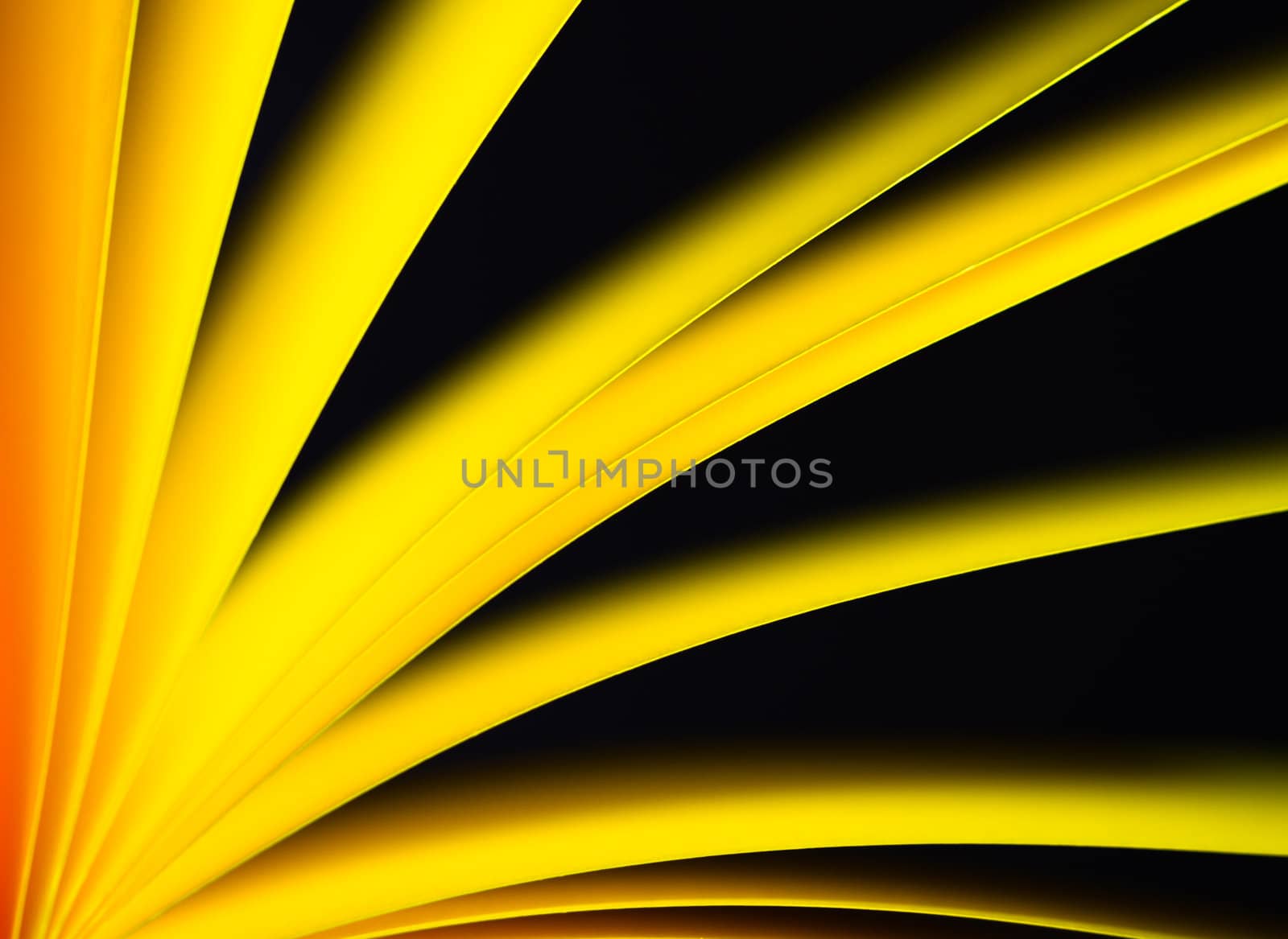 Yellow notepad paper illuminated by LED light with black background