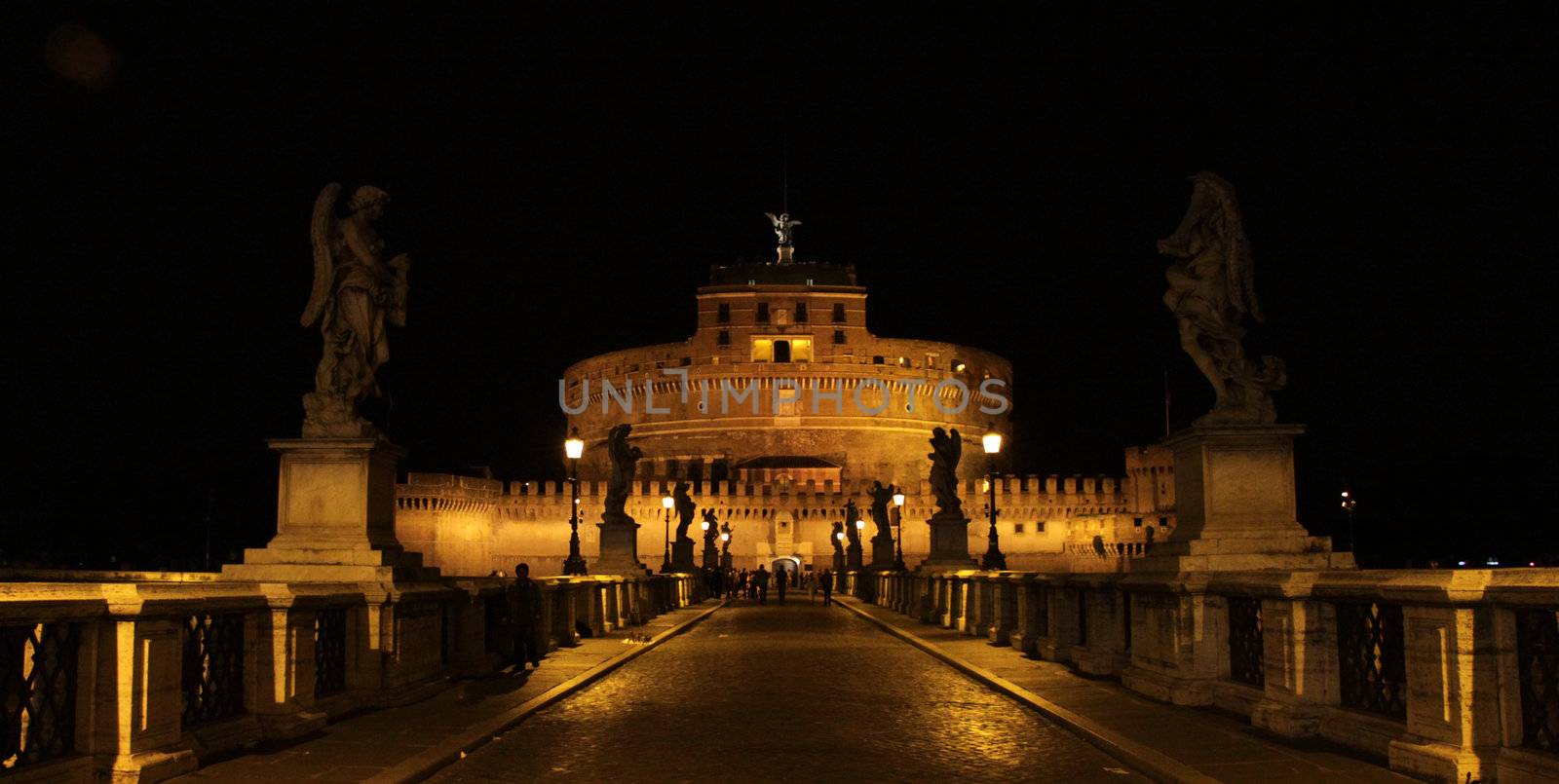 The towering Castel Sant'Angelo (Mausoleum of Hadrian) in Rome, Italy.  Shot at night from Ponte Sant Angelo.
