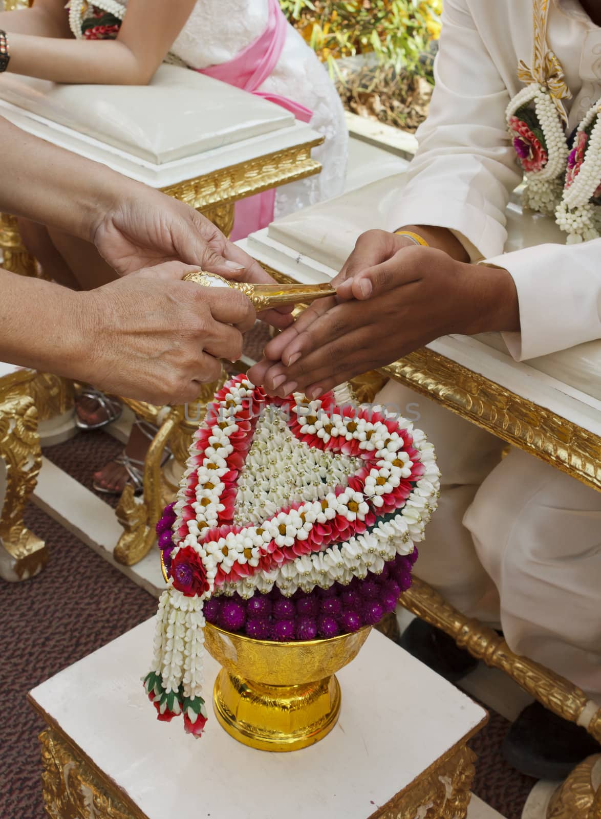 Blessed water at Thai wedding ceremony in Thailand