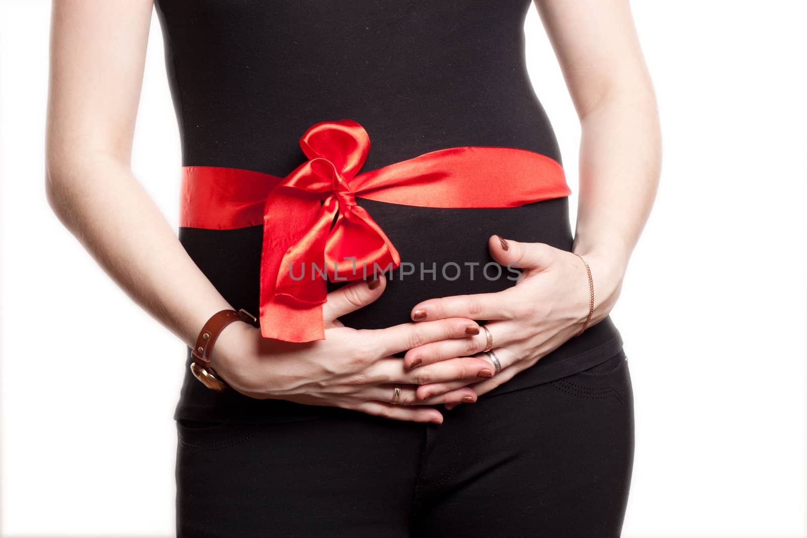 Pregnant woman in black with big red ribbon