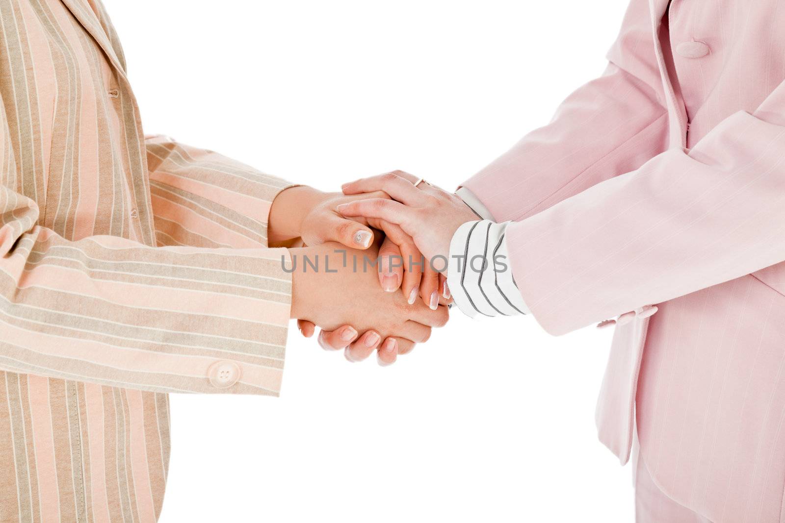 businesswomen shaking hands by vilevi
