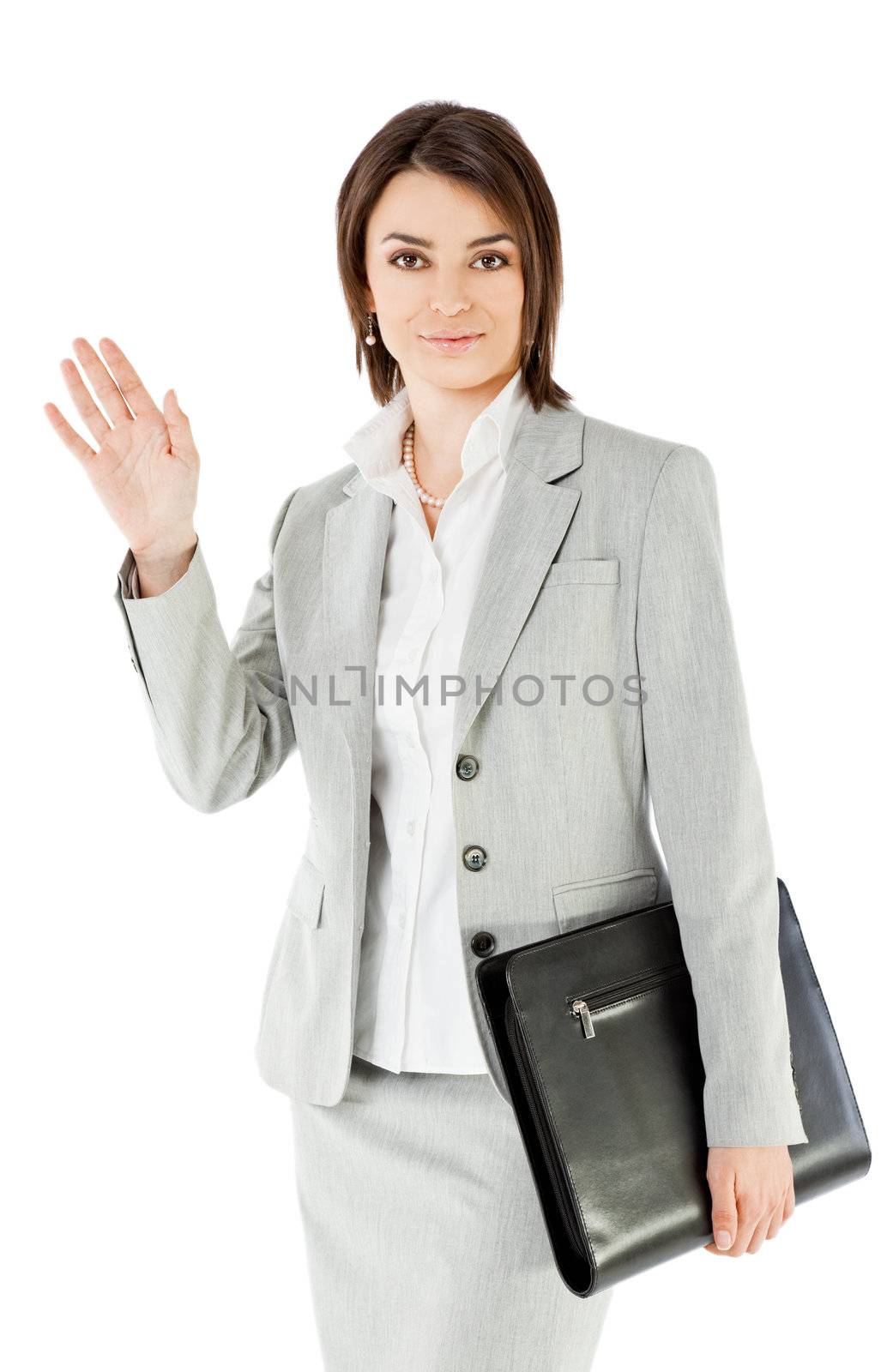 Smiling businesswoman on white background, holding briefcase waving