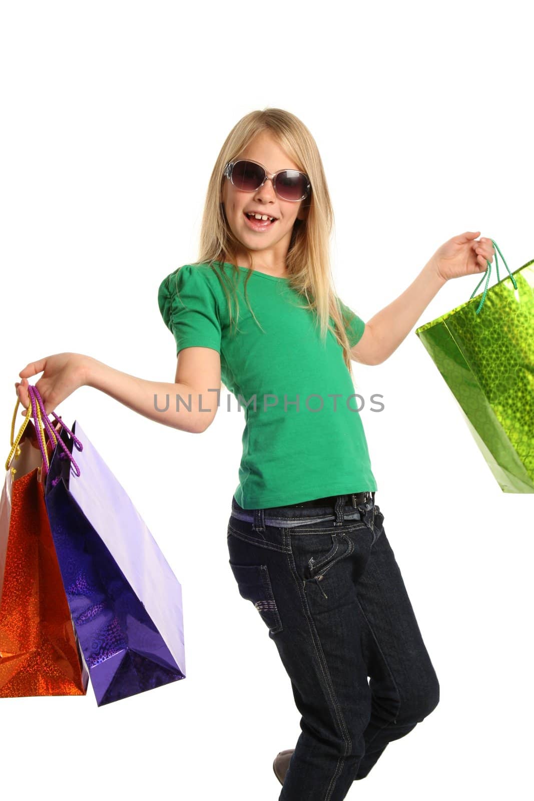 Young trendy shopper girl with colorful bags - isolated on white