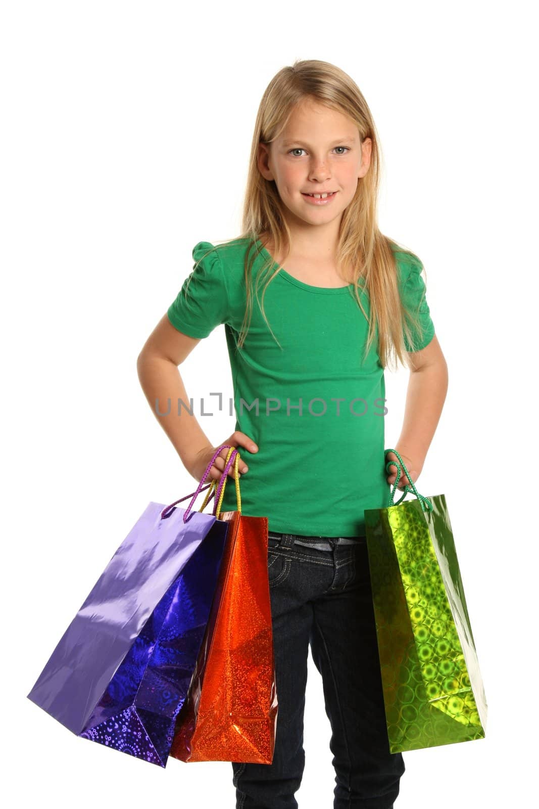 Young trendy shopper girl with colorful bags - isolated on white
