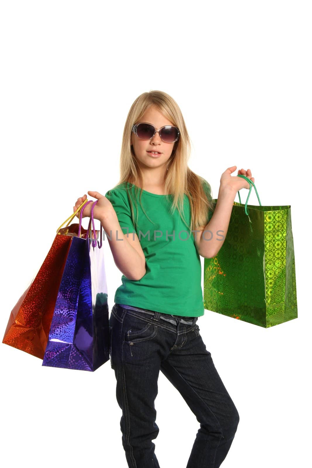 Trendy young shopping girl with bags and sunglasses