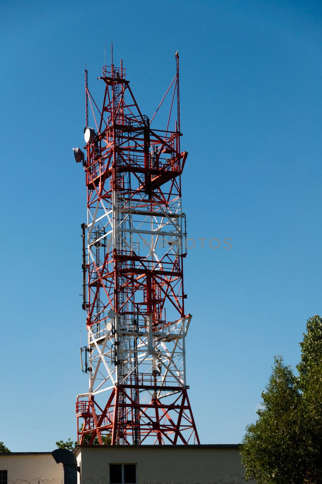 Communication tower consisting of various dishes and antennas.