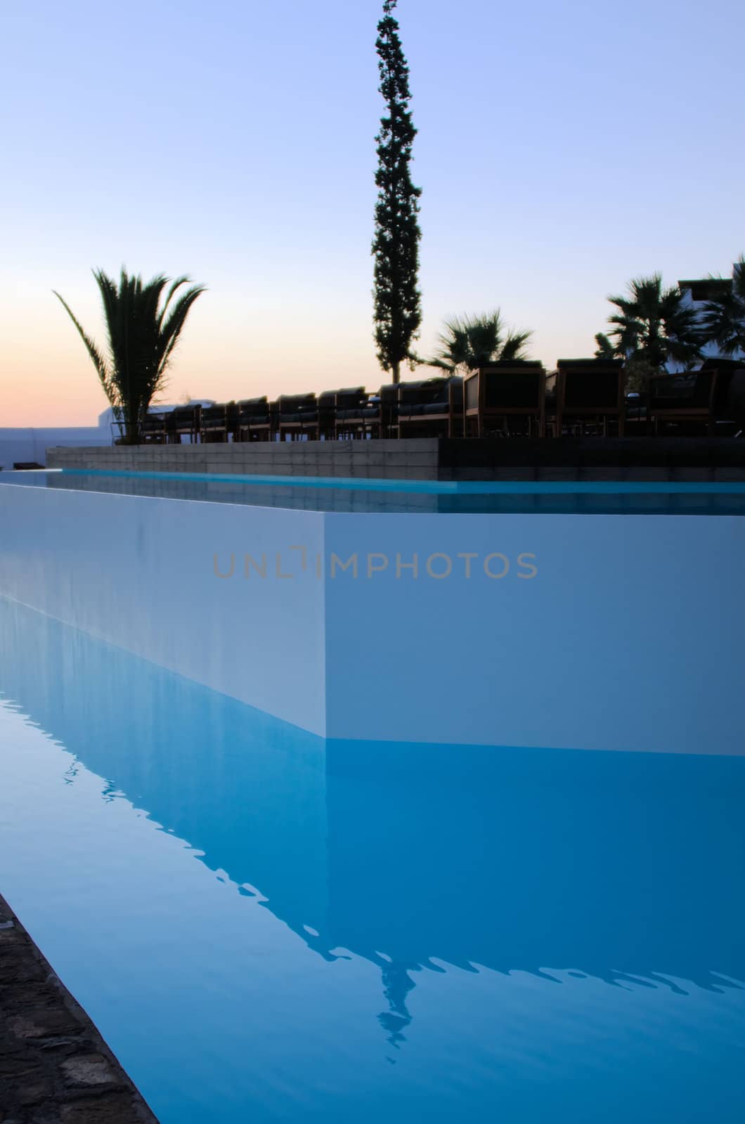a blue pool and terrace