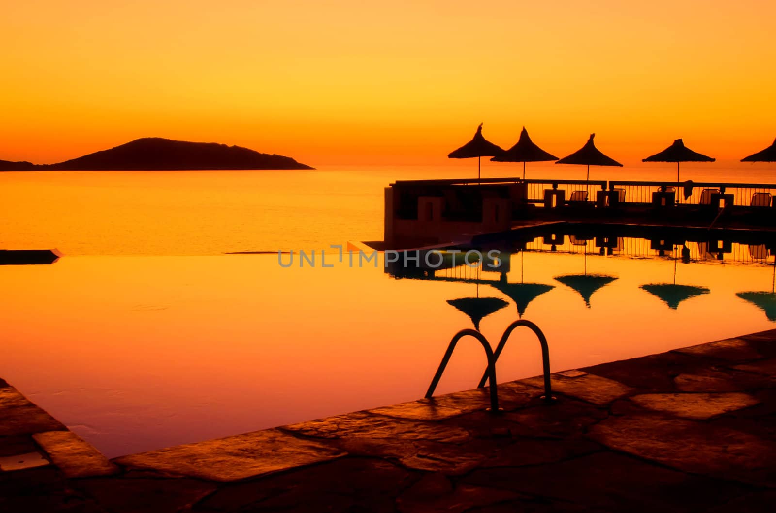 swimming pool umbrellas and sea